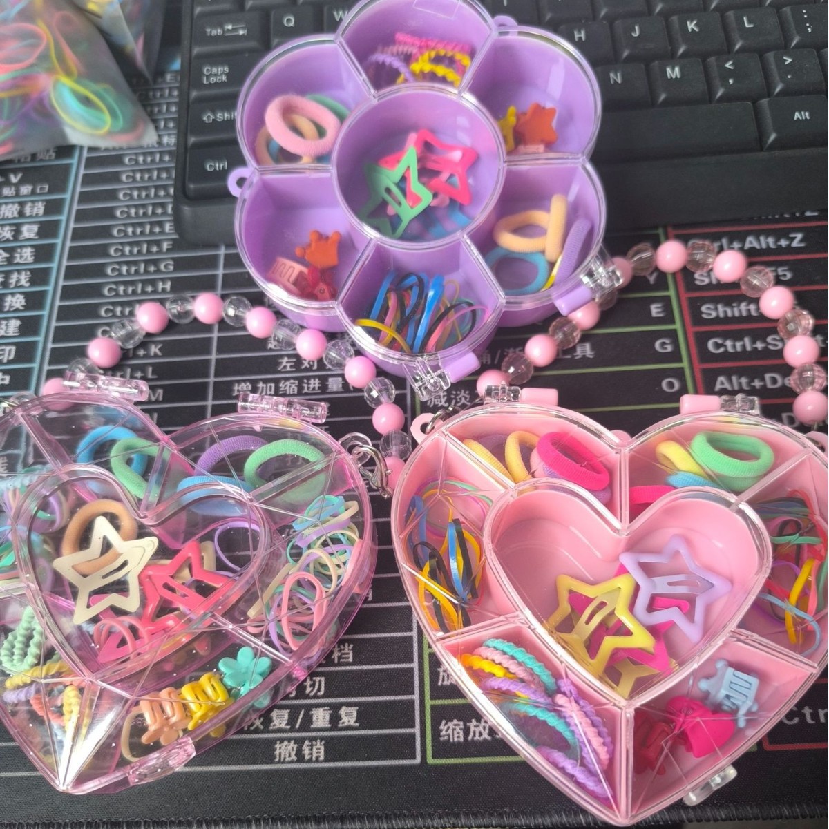 Venta directa de fábrica de coleteros para niños en cajas con forma de corazón, venta al por mayor en puestos callejeros