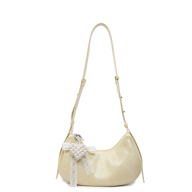 Bolso de axila de textura de alta calidad 2025 verano nuevo bolso femenino moda patrón de agarre de mano bolso bandolera con letras extranjeras