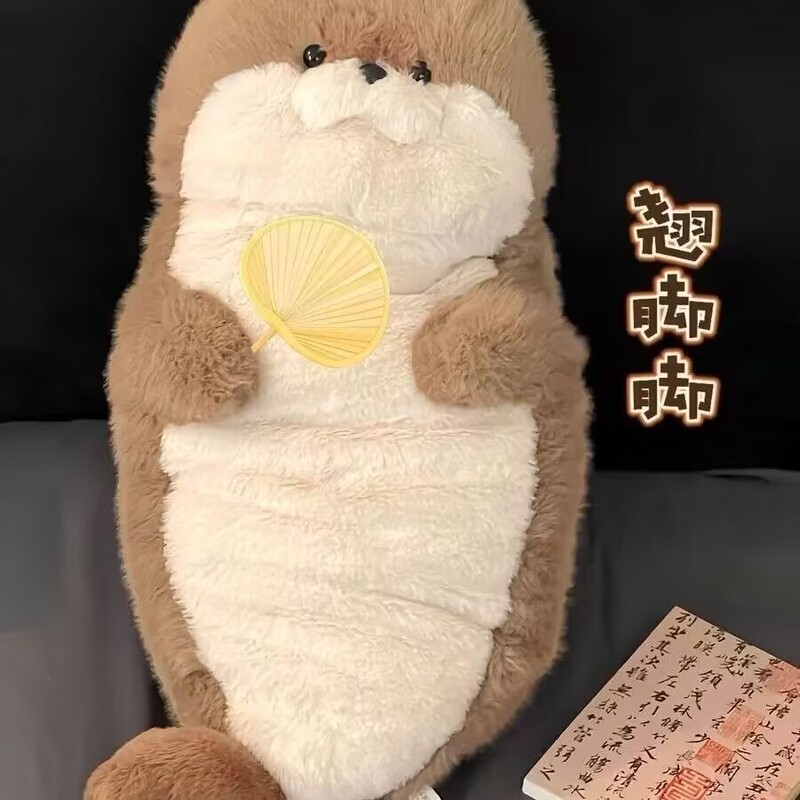 かわいいアザラシのぬいぐるみのぬいぐるみのベッドの上で寝ています。|undefined