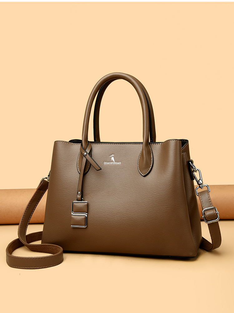 Nuevo bolso de mujer simple de moda, bolso de mano de cuero suave de gran capacidad, bolso de tela de mujer, bolso de canguro