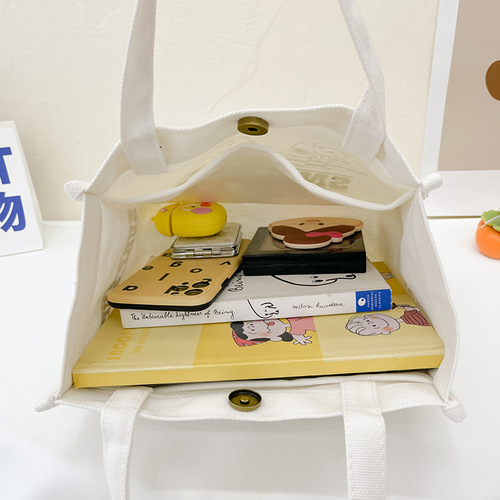 Spring new large-capacity magnetic buckle handbag, simple and versatile printed letter handbag, cute puppy canvas bag