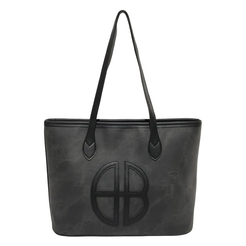Bagos de gran capacidad para viajar al trabajo, 2025 nuevos bolsos de mujer, bolsos de hombro casuales de aire extranjero, bolsos de brazo empalmados