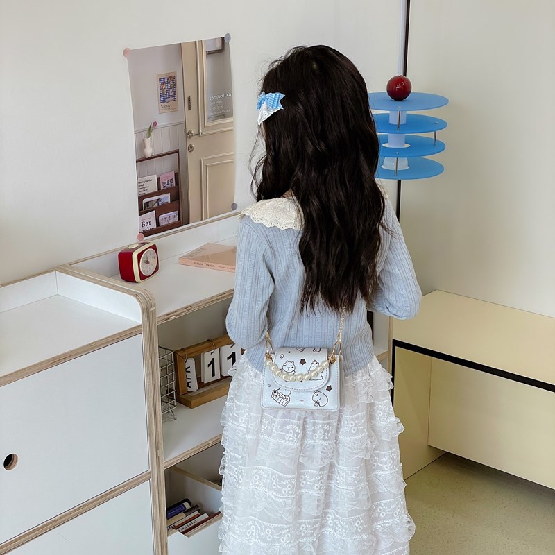 Versión coreana del bolso de hombro para niños Xiaoxiangfeng, lindo y divertido Kapibala, bolso de perlas para niños, nuevo bolso de cadena para niños