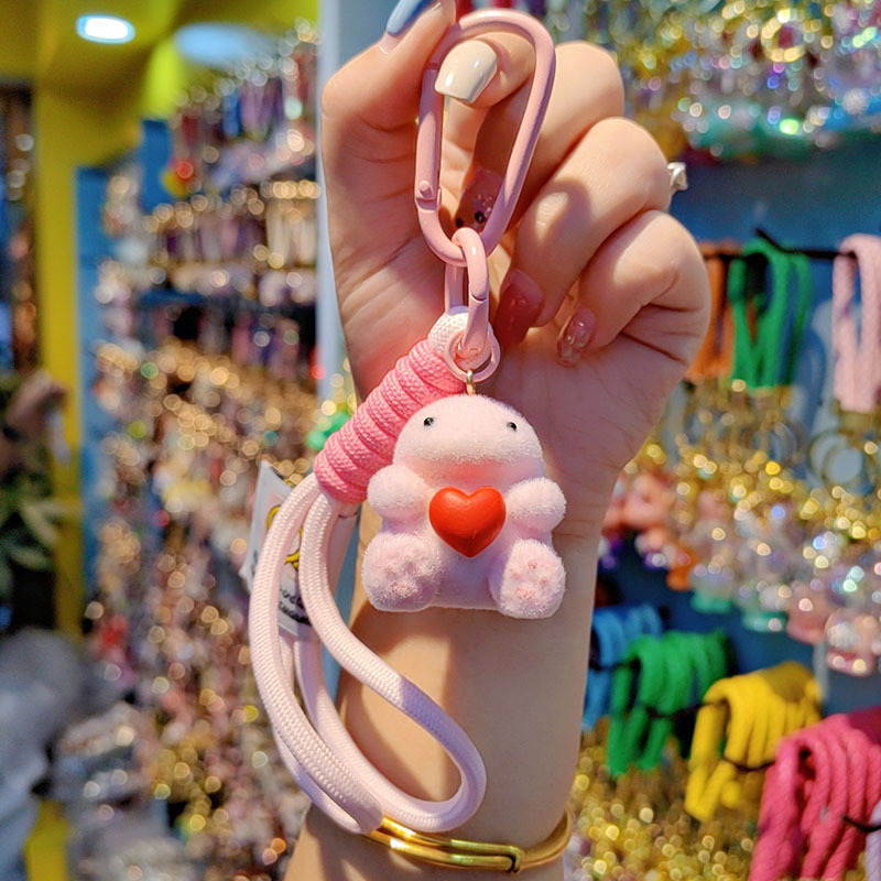 Nuevo caricatura flocado amor Godzilla llavero de moda pareja llavero bolsos de mujer accesorios colgantes de teléfono móvil joyas