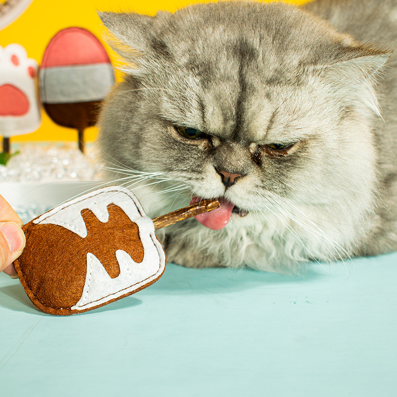 Juguete para mascotas fieltro Polygonum multiflorum posicle gato traje de juguete limpieza gato cavidad oral en stock que contiene catnip