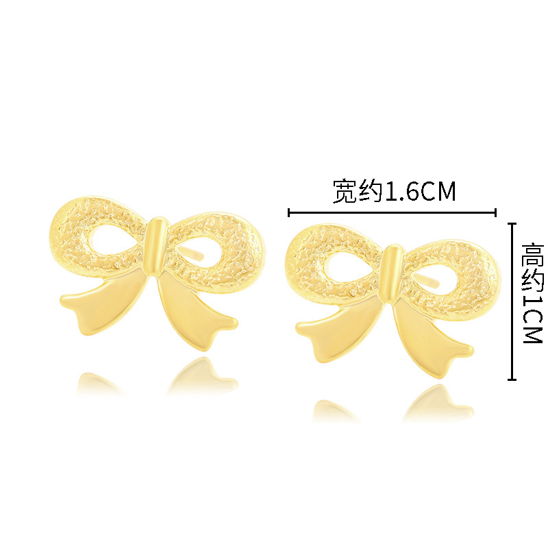 Joyería Xuping arco pernos de orejas imitación de oro encantador temperamento pequeño pendientes femeninos dulces coreanos en forma de corazón