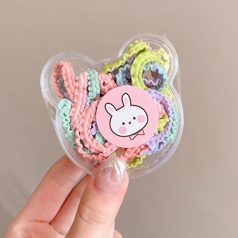 Las muchachas de la cuerda del pelo del color del caramelo no hacen daño al pelo pequeña tira de goma Lazo de la cuerda del pelo tocado niños lindos cubierta de cuero de la banda del pelo del bebé