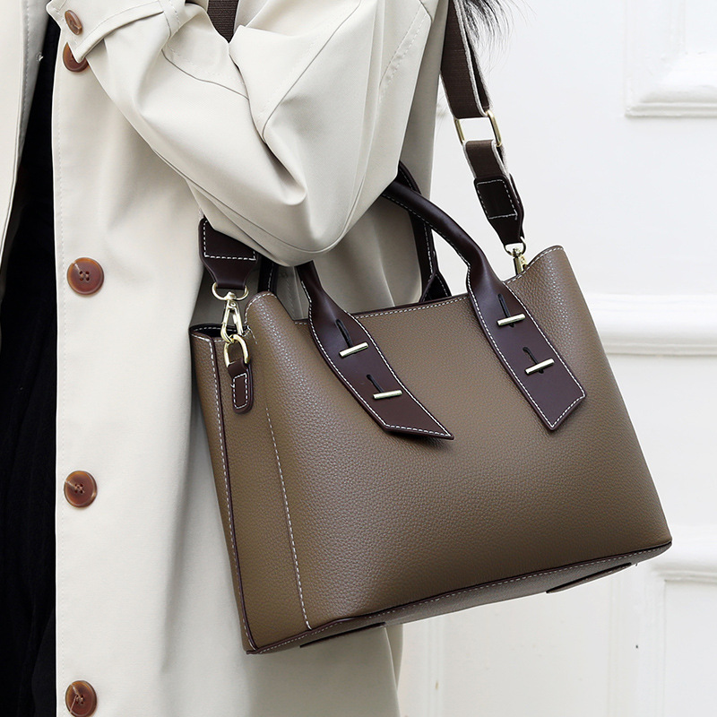 Bag New 2024 women's handbag commuter large capacity wide shoulder strap messenger bag European and American fashion portable women's bag_voghion.com