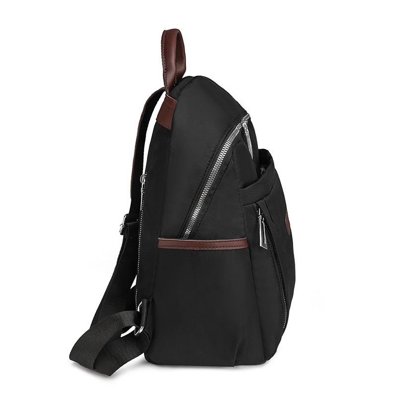 Venta al por mayor transfronteriza 2024 invierno nuevo estilo casual damas mochila de nailon simple y versátil mochila de viaje ligera marea