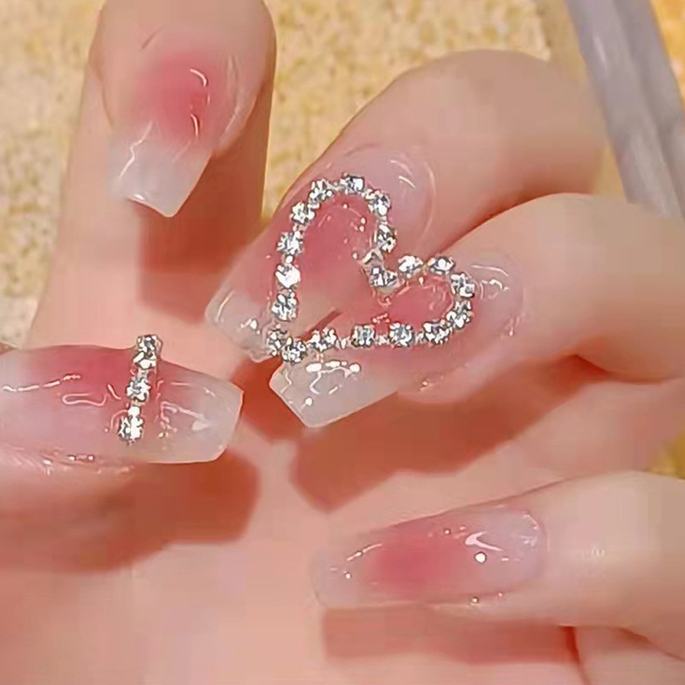 Ventas domésticas cortas de perforación de punto de fábrica de uñas al por mayor para diseñar parches de manicura falsas desmontables
