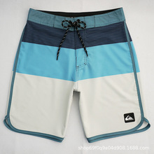 Quiksilver��ó��̲���˿��ˮ�ٸ�ɳ̲�����������ֶ̿���Ӿ��
