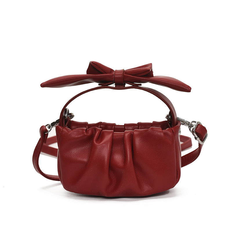 Versión coreana del bolso de nube de niña de color sólido simple estilo occidental pliegue lindo lazo bolso de bebé nuevo bolso para niños