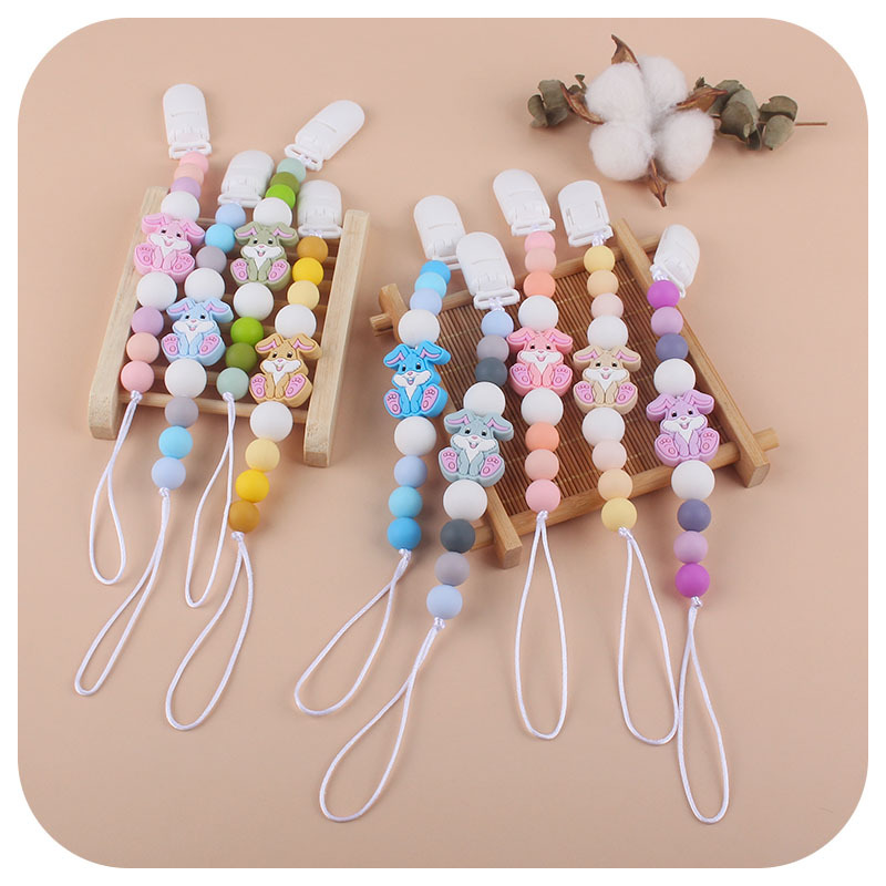 Nueva Cadena de chupete de silicona de dibujos animados creativo conejo de silicona juguete mordedor perlas molares pezón cadena anti-caída