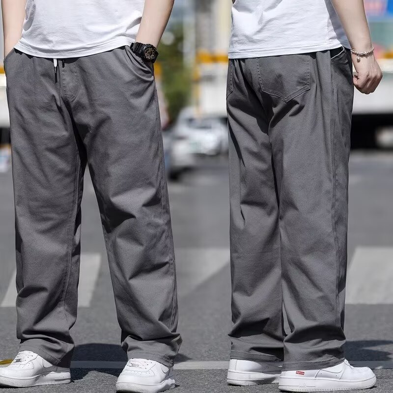 デブの大きいサイズのカジュアルなズボンの男性は春と夏に太って、ゆったりとしたストレートなズボンの太った薄いタイプの緩いズボンを大きくします。|undefined