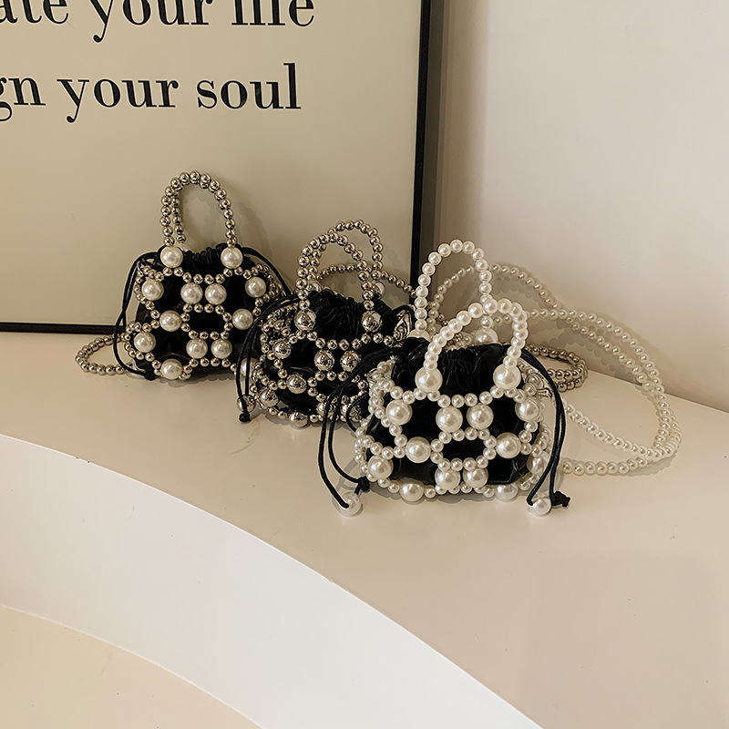 Versión coreana del nuevo estilo de verano bolso de mensajero para niños lindo perla bolso para niños y niñas mini bolso de hombro para niñas de estilo occidental