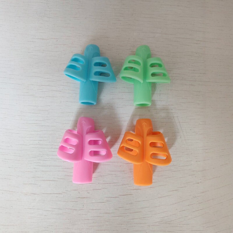 Silicone double-finger grip pen holder for children, designed to correct writing posture; soft rubber pen sleeve for elementary school students to practice writing; colorful pen caps Silicone double-finger grip pen holder for children, designed to correct writing posture; soft rubber pen sleeve for elementary school students to practice writing; colorful pen caps
