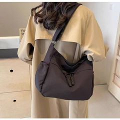 シンプルな容量の大きいキャンバスバッグの女性カジュアルに合わせて通勤します。