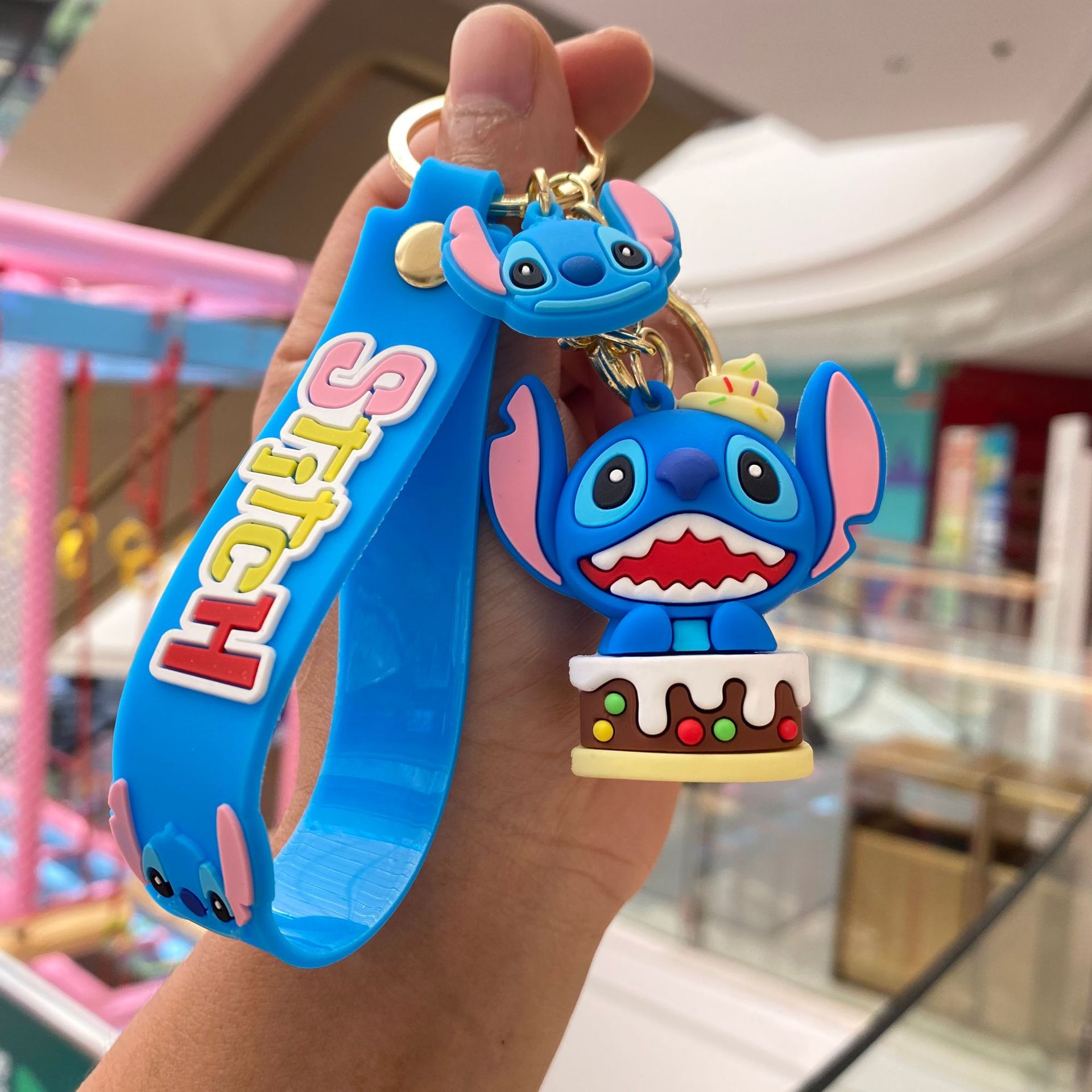 Dibujos Animados transfronterizos codiciosos puntada llavero colgante bolsa coche llavero muñeca rascando máquina regalo al por mayor