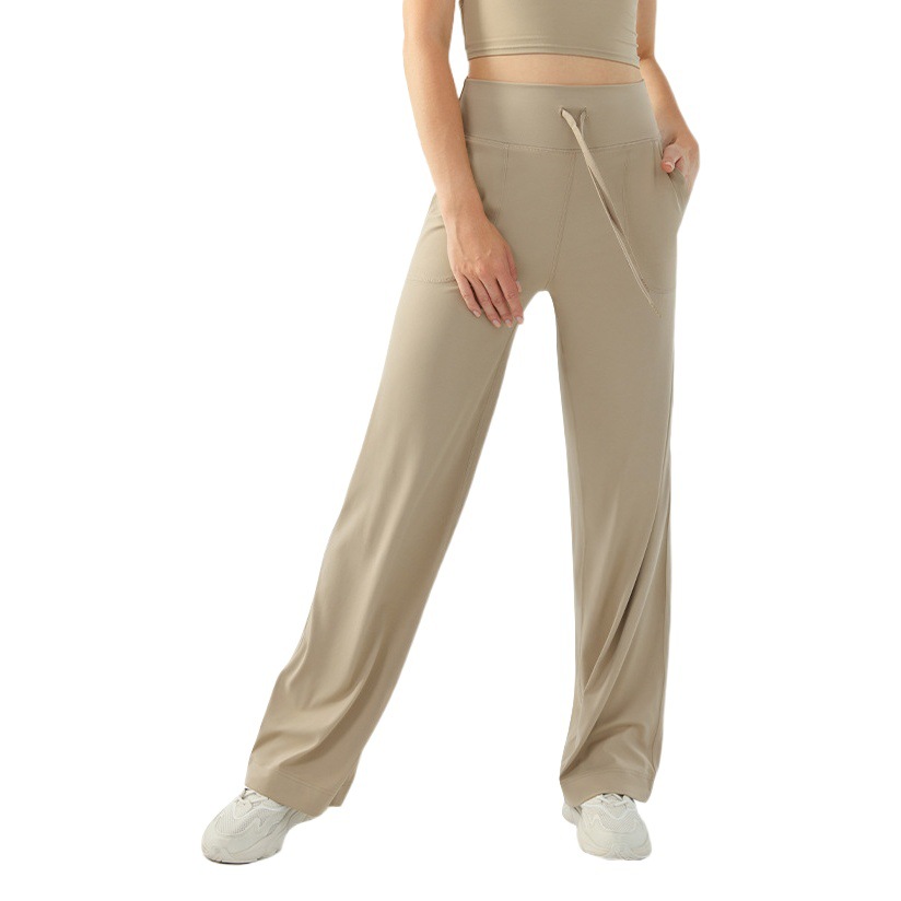 裸感の高い腰のひもの運動のズボンの女性のゆったりしている広脚の純色のフィットネスのズボンのランニングはスリムに見えます。