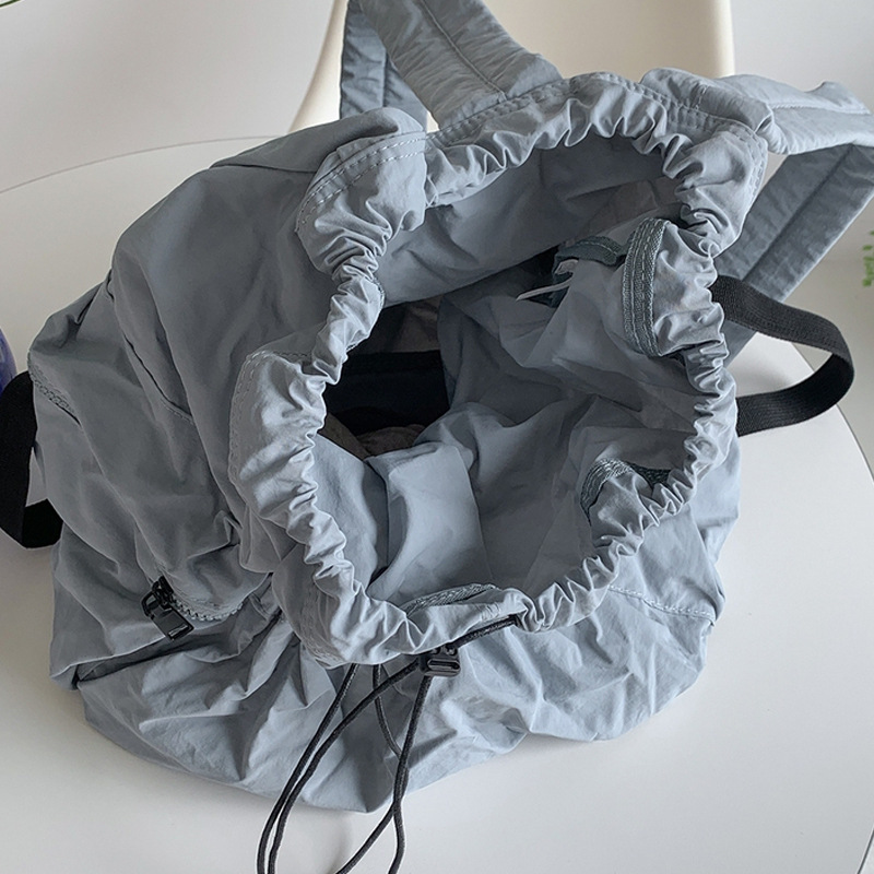 Corea del Sur Dongdaemun nuevo cordón mochila mujer casual gran capacidad estudiante mochila versátil mochila de nylon ligero