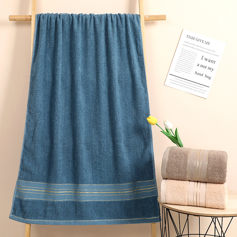 Bath towel cotton 70*140 gold silk bath towel absorbent thick embroidered logo foreign trade export bath towel tail list factory wholesale Bath towel cotton 70*140 gold silk bath towel absorbent thick embroidered logo foreign trade export bath towel tail list factory wholesale