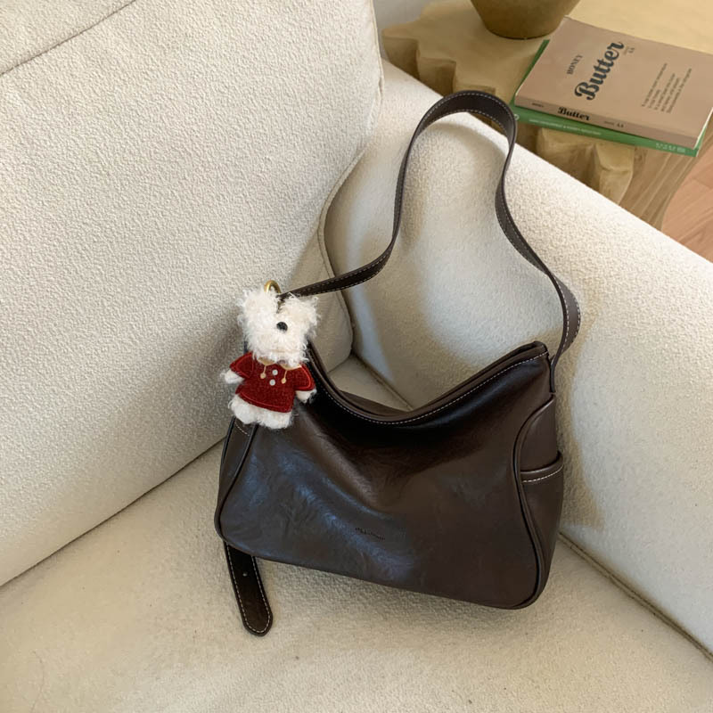 Coreano de cuero suave de alto nivel de hombro bolso de brazo para mujeres 2025 nueva bolsa de transporte de viaje bolsa casual versátil mochila