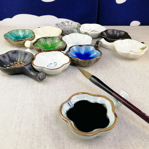 Wholesale porcelain inkstones, plum blossom plates, inkwell holders, ink basins, chopstick rests, and essential oil trays from foreign trade manufacturers.