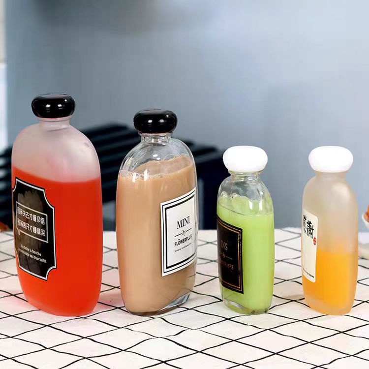 批发玻璃饮料瓶创意磨砂透明酒瓶带盖果酒瓶扁形玻璃瓶空瓶小酒瓶