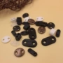 不断两孔可折叠穿绳皮纽扣