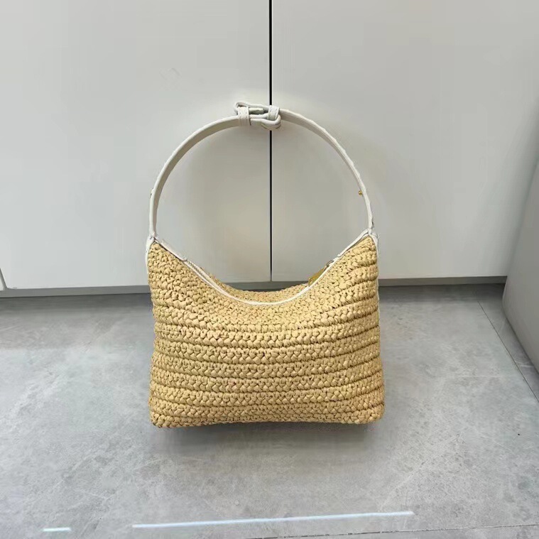 Straw bag lunch box bag 2025 early spring new beach vacation raffia grass hand bag niche single shoulder armpit women's bag