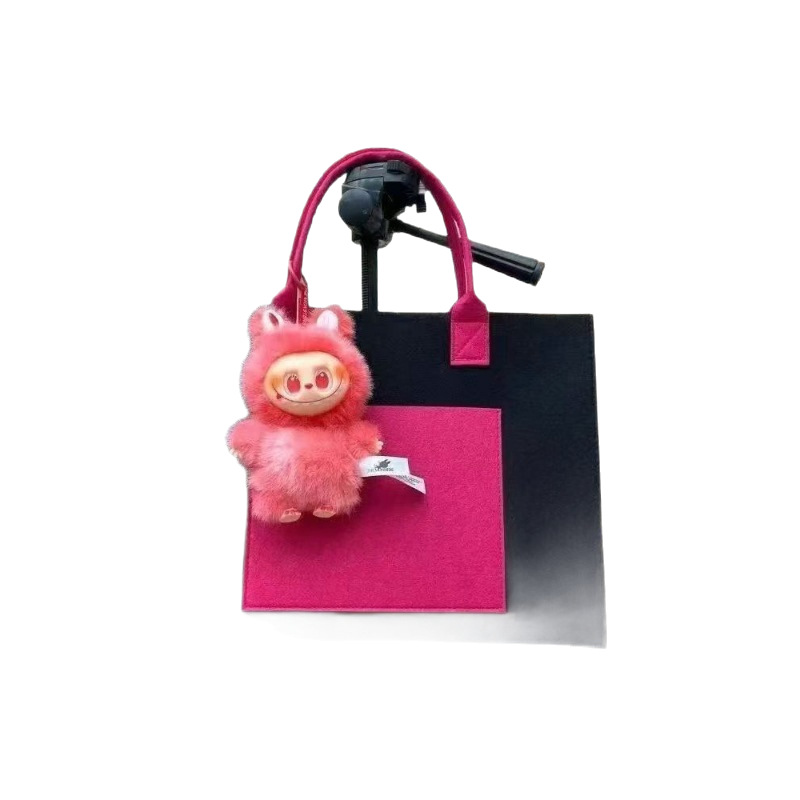 Nuevo colgante de mochila de tela Rabu pellizcar música pu rebote lento artefacto de descompresión juguete decoración de escritorio muñeca al por mayor