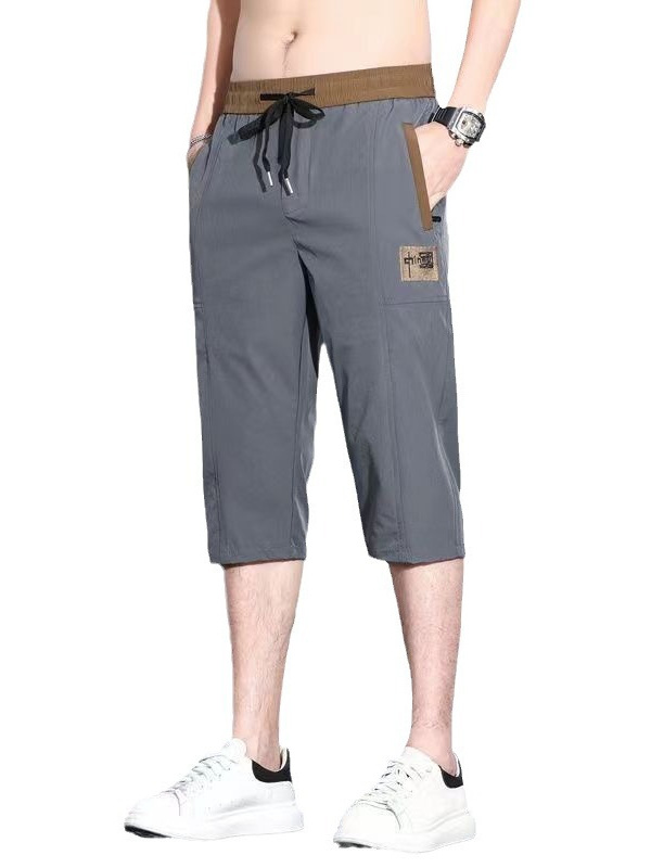 Pantalones cortos de siete puntos para hombres de verano delgados sueltos de moda versátil pantalones casuales bordados con cremallera anti-robo pantalones rápidos de moda para hombres