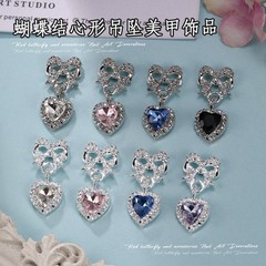 春夏の新スタイルのリボンピーチハートペンダントネイルアートジュエリー、甘い気質、ダイヤモンドがちりばめられたネイルピーチハートリボンジュエリー