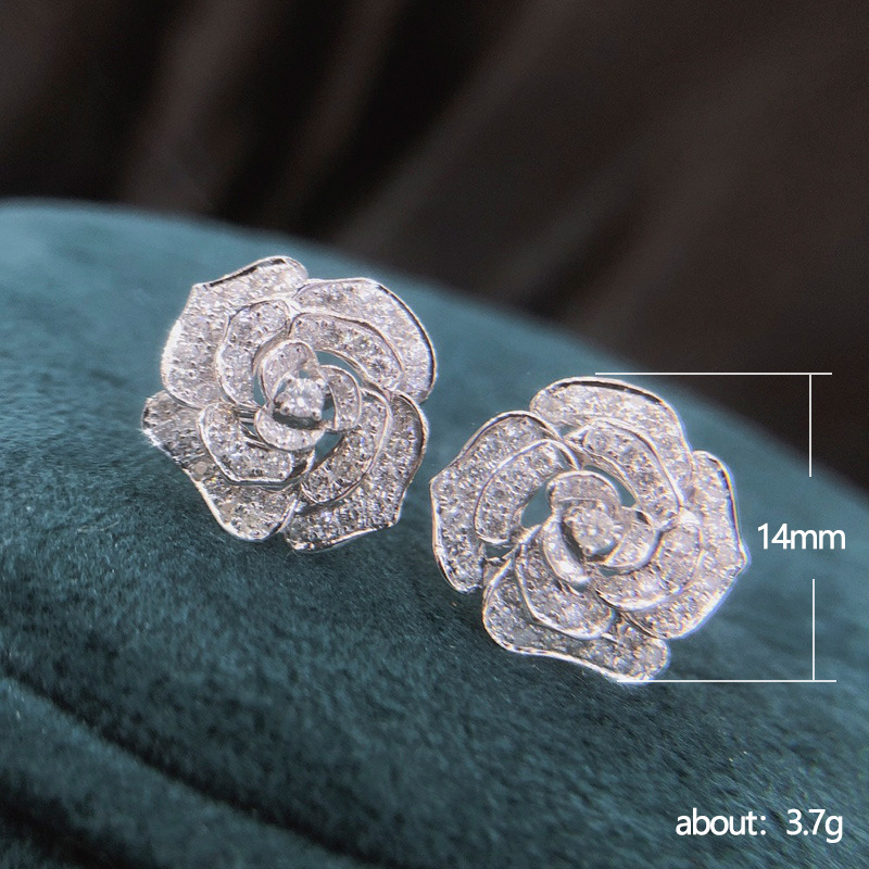 Retro Hollowed Flower Shaped Inlaid Zircon Copper Earrings Wholesale display picture 1