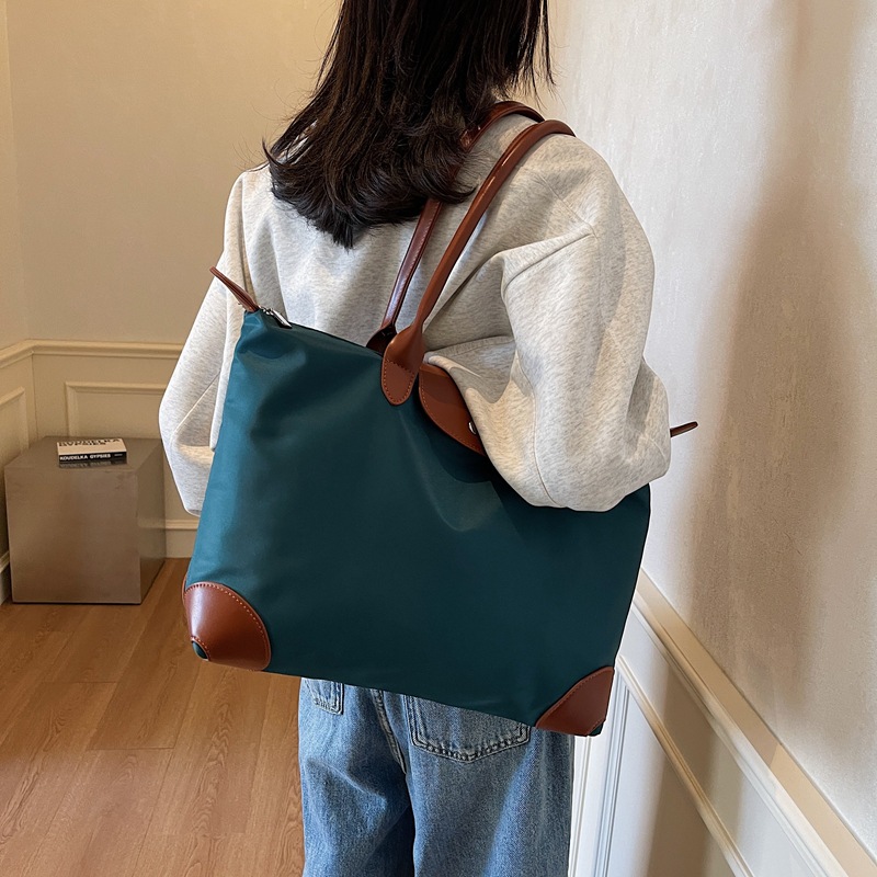 Bolsas de viaje transfronterizas de gran capacidad de sensación de alto nivel bolsas de bolsas de bolsas de alojamiento en espera de producción bolsa de almacenamiento de acondicionamiento físico bolsas portátiles al por mayor