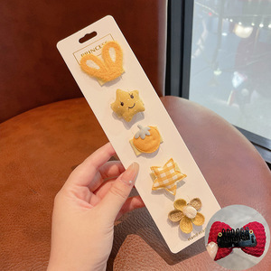 Hermosos clips de cabello de color para niños coreanos de alto nivel sensación de arco de niñas bolsa de tela no daña clips de cabello de bebé