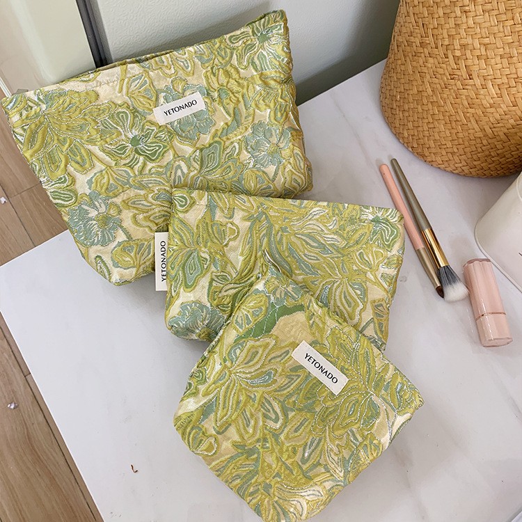 Cross-border ins-style three-dimensional embossed floral makeup bag with a gentle texture, portable storage bag, and handbag for outings