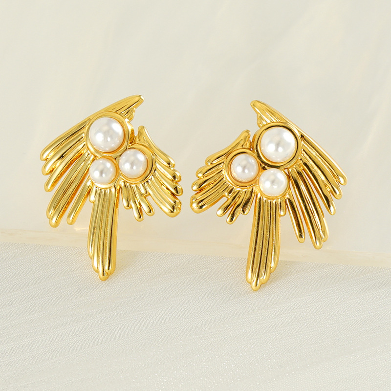 Nuevos pendientes irregulares franceses de alta gama para mujer Pendientes de perlas de golondrina de 18 quilates Pendientes de acero de titanio con personalidad de moda