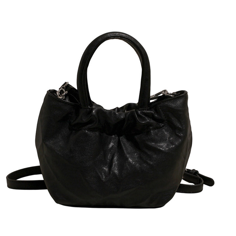 2025 nuevo bolso de cubo portátil de color sólido de diseño de nicho para mujer, bolso de mensajero de un solo hombro simple y moderno de alta gama para mujer