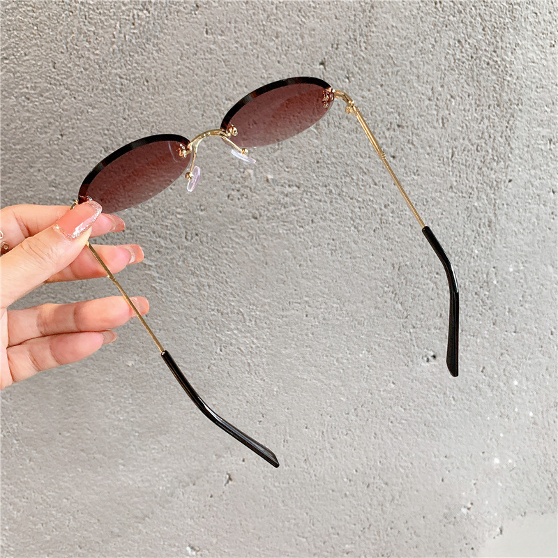 New Sunglasses Women's Oval Gradient Sunglasses Frameless Cutting Edge Trendy Glasses_voghion.com