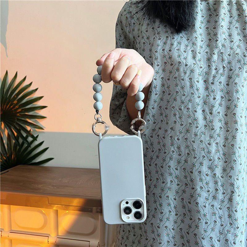 Cáscara de teléfono móvil iphone15 diagonal portátil de color sólido 16ProMax simple y elegante para Apple 14 nueva mujer 13