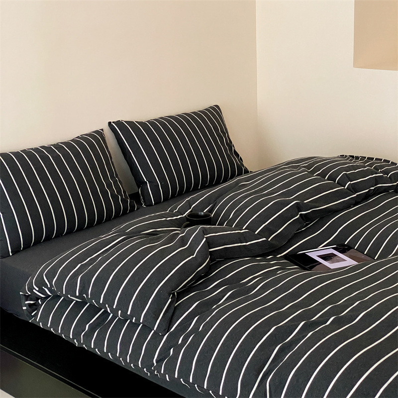 Factory wholesale Nordic style simple black and white striped Tianzhu cotton knitted cotton four-piece cotton naked sleeping bedding