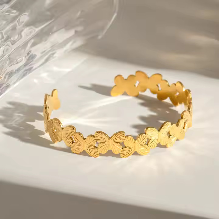 Tina transfronteriza 18k oro mariposa pulsera de acero inoxidable mujer alta sensación de diseño de personalidad versátil pulsera de acero de titanio ins