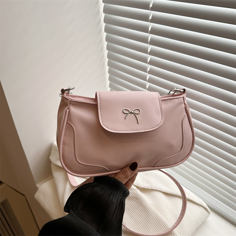 Bolsa de viaje retro para mujeres 2025, nueva moda, bolso de brazo de arco de moda, bolso de brazo elegante y dulce.