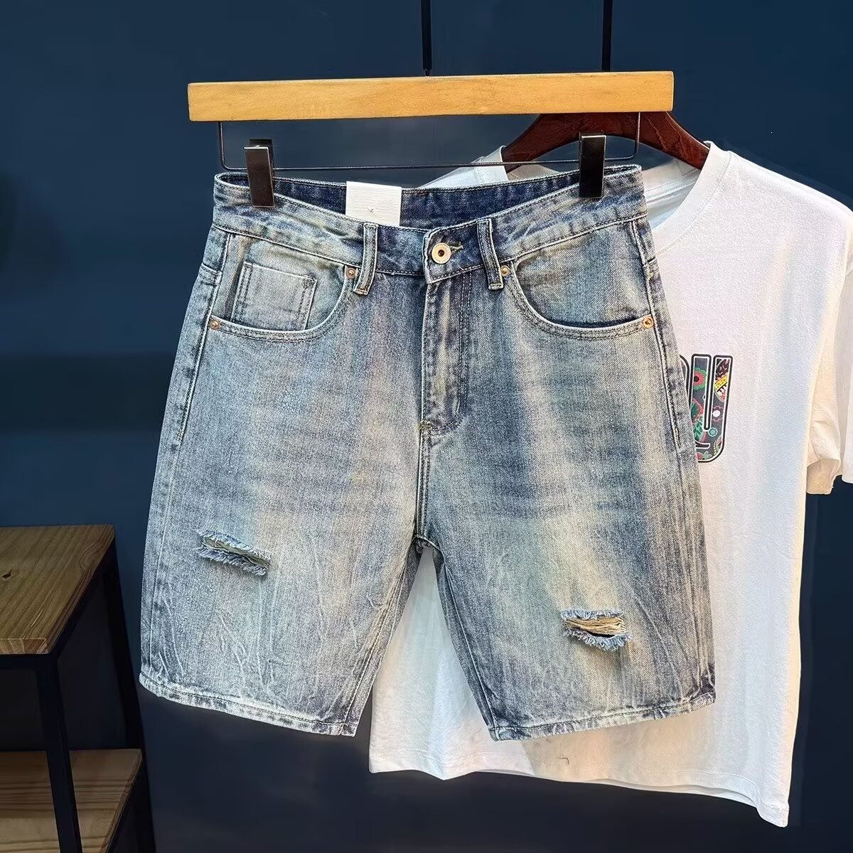 Light blue ripped denim shorts for men, new summer 2026 style, lightweight lyocell loose fit, men's five-point pants.