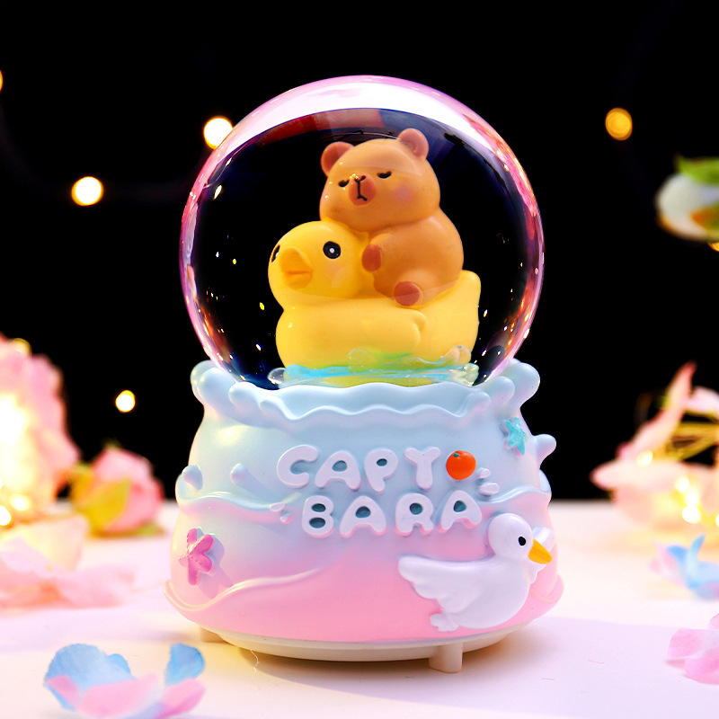 Red roja caliente Kapibala bola de cristal caja de música nieve que brilla estudiantes niños regalos navideños decoración de la habitación