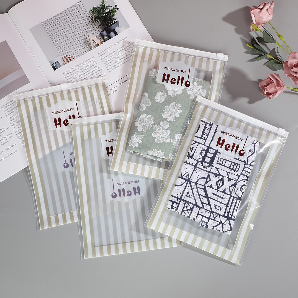 Bolsa con cremallera de ropa Bolsa con cremallera de crisantemo pequeño Bolsa de embalaje de camiseta Bolsa de ropa interior Bolsa de ropa PE esmerilada pequeña bolsa ziplock