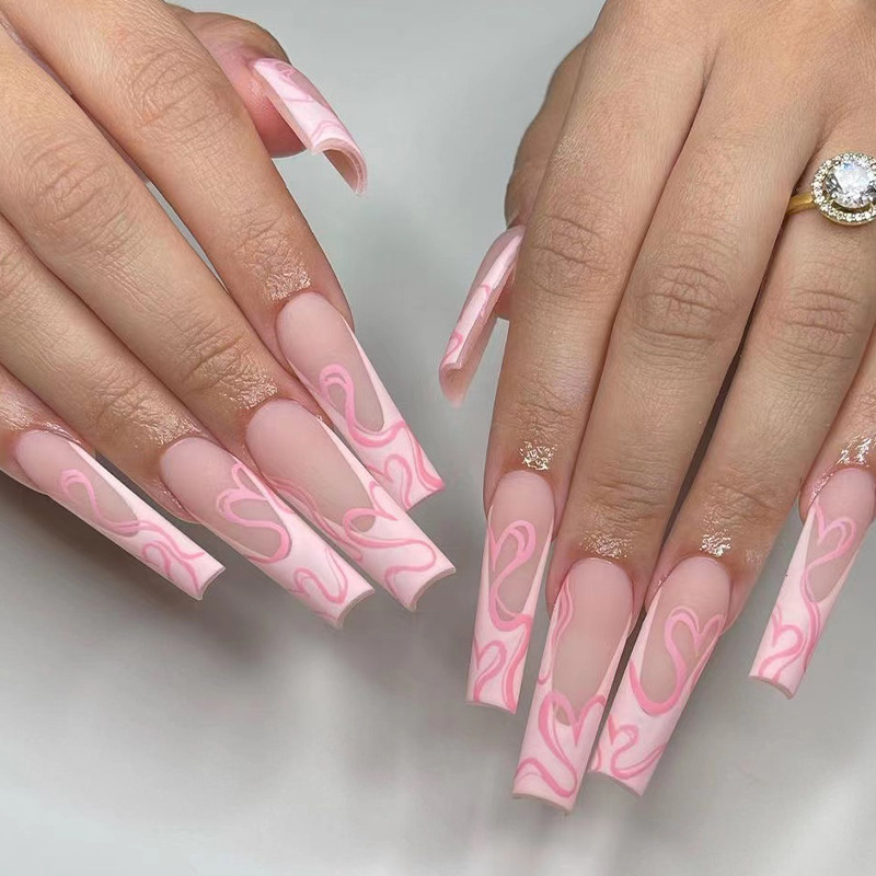 Wearing nail long matte ballet nail pink...