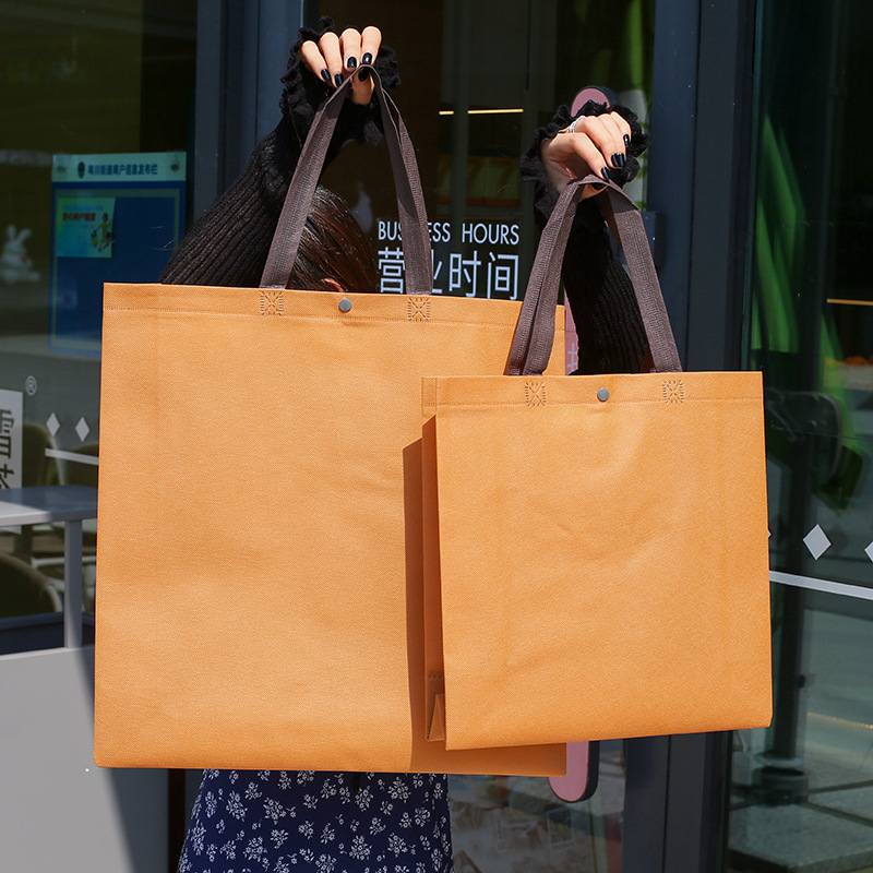 高档焦糖无纺布服装店手提购物袋子女装衣服包装礼品打包袋带可定