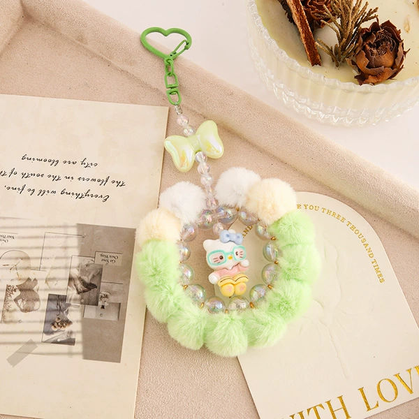 12 large fur balls - green